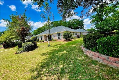 View of property exterior with a yard