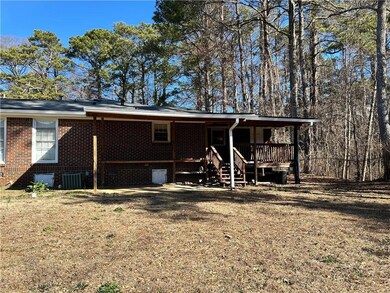 Back of property with brick siding