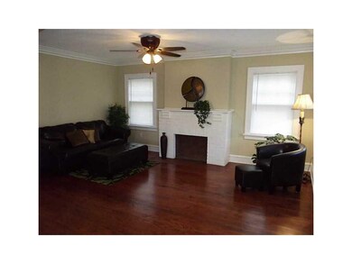 Den/Study. Decorative fireplace centers this large