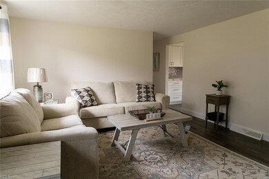 Living room with wood-type flooring