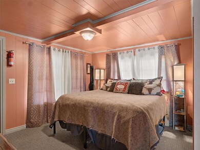 Bedroom with carpet flooring, ornamental molding, 