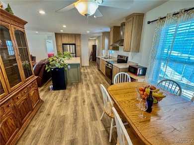 Kitchen with stainless steel appliances, light cou