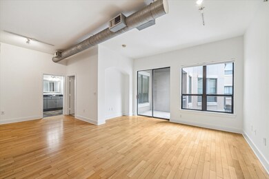 The large windows and a sliding glass door lead fr