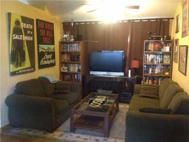 Exterior Front. Cozy den is located in middle of home. Sliding glass door behind blinds.