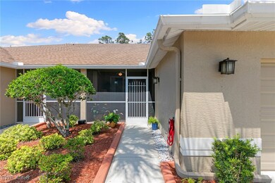 Doorway to property with stucco siding