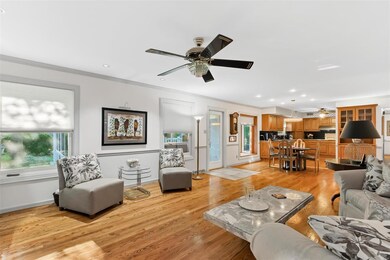 Family room is open to the breakfast room, kitchen, & 4 seasons room.