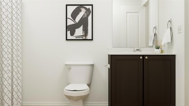 Bathroom with vanity with extensive cabinet space 