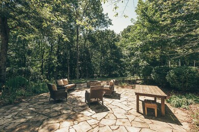 Stone patio with fire pit—another place to roast marshmallows, entertain, and relax.