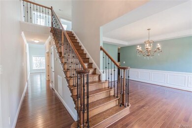 Beautiful staircase at two-story entry, Wood Floor