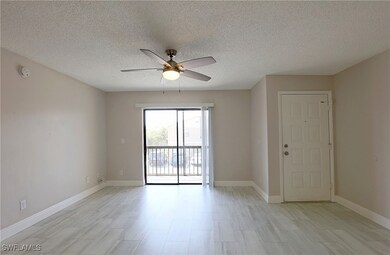 Empty room with a ceiling fan, a smoke detector, a