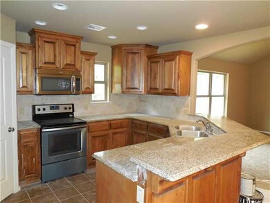 Kitchen. Home to be similar to photos.