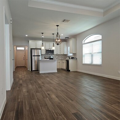 View of Open Kitchen/Dining From Back of Family Ro
