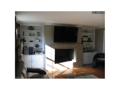 Family Room features a woodburning fireplace flank