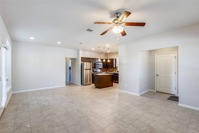 Unfurnished living room with recessed lighting, ceiling fan, and light tile patterned floors