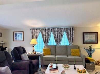 Living area with a wainscoted wall