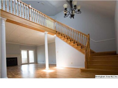 Entrance to two-story foyer with newly finished ha