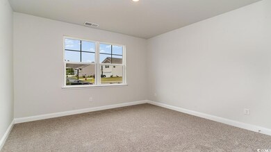Unfurnished room with carpet