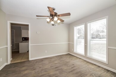 Spare room featuring light wood finished floors and a ceiling fan