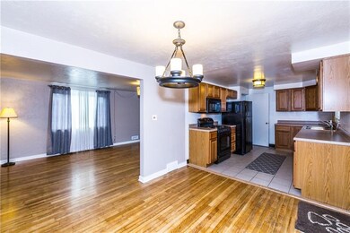 Newer light fixture in the dining room open to the