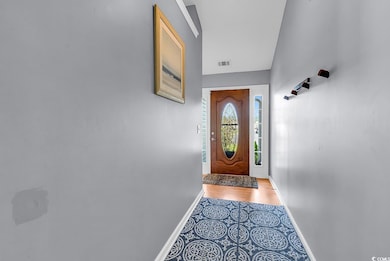 Doorway featuring baseboards