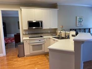 Kitchen with stainless steel microwave, oven, a pe