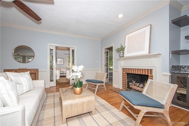 Hardwood floored living room with a fireplace and