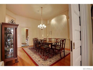 Expansive formal Dining Room with room for banquet style dining...note the columned wall with built in shelving.