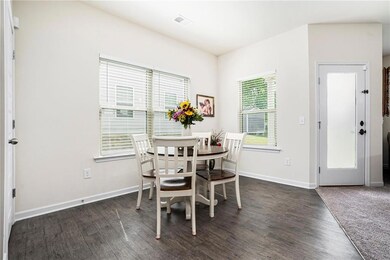 Dining room featuring wood finished floors and baseboards