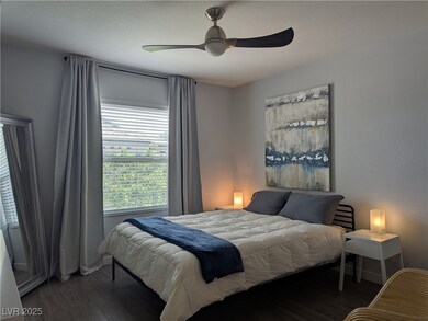 Bedroom featuring wood finished floors, ceiling fa