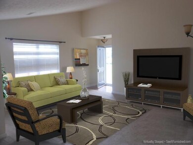 This picture is digitially staged - there is no furniture in the home and none of the  furnishings seen here are included in the sale.