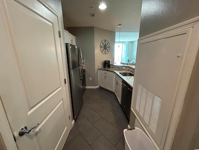 Kitchen with dishwashing machine, visible vents, w