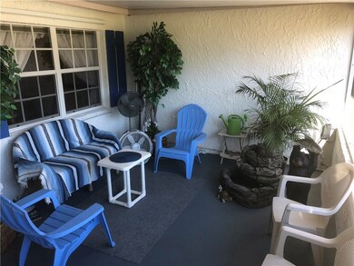 Inviting Covered and Screened Front Porch