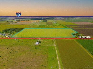 Aerial view at dusk of a view of rural / pastoral area, property boundaries highlighted, and agricultural plots