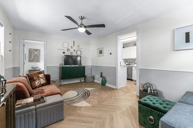 Living room with light parquet floors and ceiling 