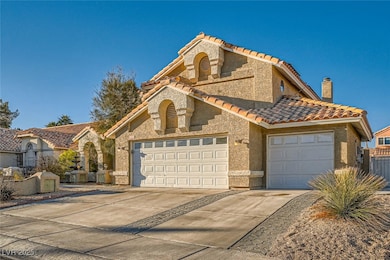 Mediterranean / spanish-style home with a garage,