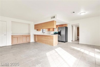 Kitchen with stainless steel fridge with ice dispe