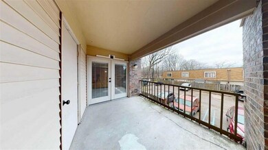 Balcony featuring french doors