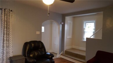ENTRY WITH CERAMIC TILE FLOOR. GUEST CLOSET. STAIRWELL TO SECOND FLOOR.