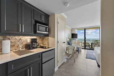 Sleek kitchenette equipped with brand-new stainles