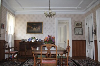 The Formal Dining Room also has an ornate ceiling!