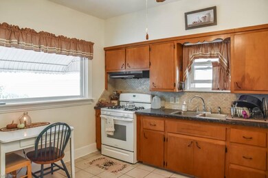 Kitchen has a large window.