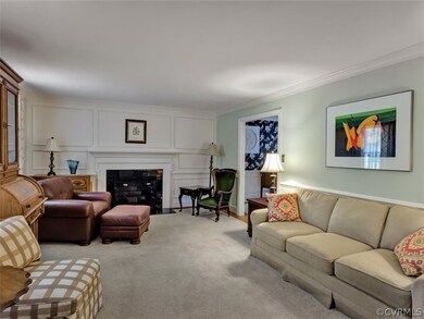 Living room with picture moulding flanking the fir