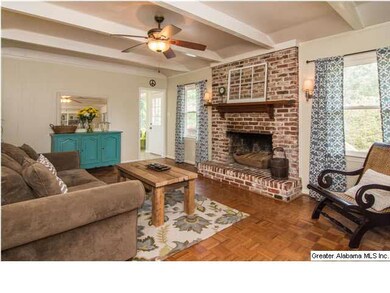 Private den in the rear of the home with wood burn