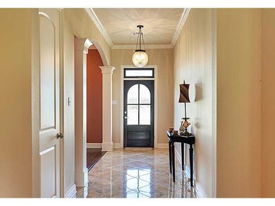 Foyer. Gleaming tile, gentle arches, and exquisite