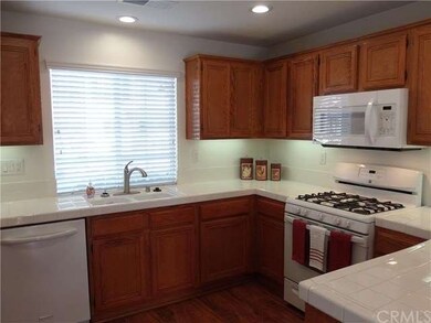 Kitchen has all new LED Can lights, the cabinets have been freshly stained, new sink and faucet and plumbing hardware under sink.   There is so much counter space in this kitchen, you will love it.  The appliances are newer.  The kitchen window looks