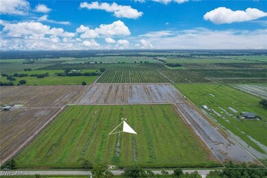 Birds eye view of property featuring a rural view
