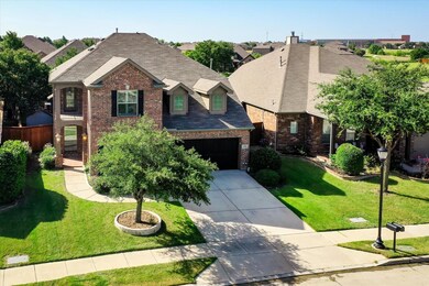 View of front of property with a garage and a fron