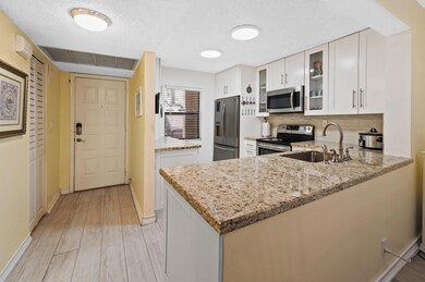 Looking at open kitchen and front door