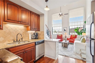 The kitchen is graced with quality cabinetry, stainless appliances, and granite counters - and lots of counter space, too.