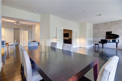 Great Room showing exposed brick wall